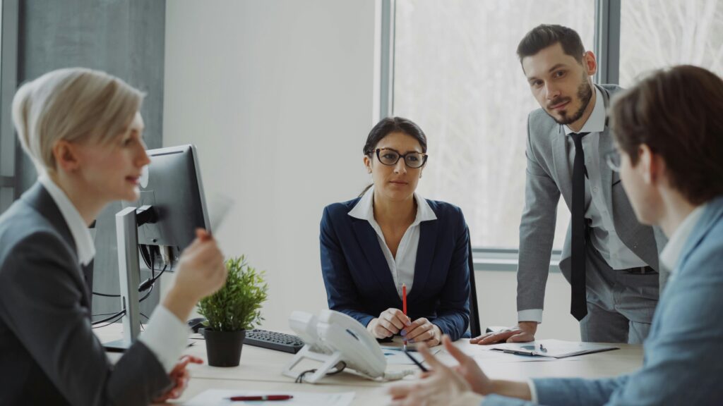 Group of human resources experts engaging in a corporate strategy meeting to improve employee performance and workplace management.